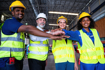 Confident Manager visit engineer teamwork at manufacture factory gathering hands portrait together