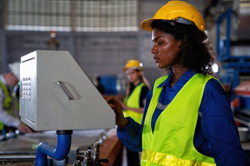 Female engineering operator wearing uniform Quality control maintenance,checking process in factory