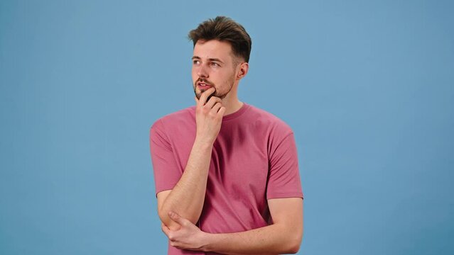 Man ponders difficult question massaging chin with fingers