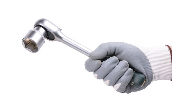 A hand in a protective glove holds a ratchet wrench (socket) on a white background.