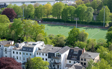 Drone view of a football field in an old neighborhood in Hamburg, Germany.