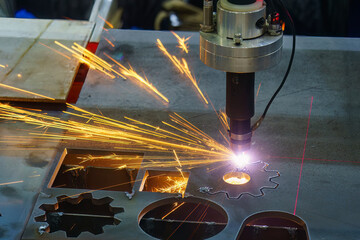Close-up scene the laser cutting machine cutting  machine cut the metal plate with laser beam...