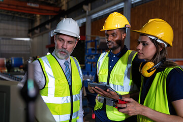 Plant manager visit engineer in factory at production line discuss on quality assurance improvement