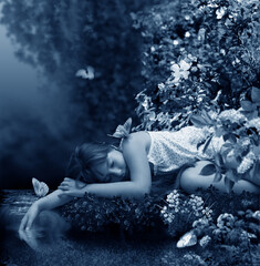 Warm summer night. Forest stream. The girl is asleep on the shore of stream. She is seen sleeping sweetly with her hand trailing in the water. The stream is dissolved in the forest haze. Butterflies f