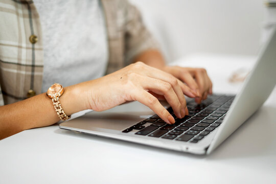 A Girl Working On His Laptop Asian Businesswoman Using Laptop Computer To Work Online Searching For Technical Information On The Internet Sitting At A Desk.