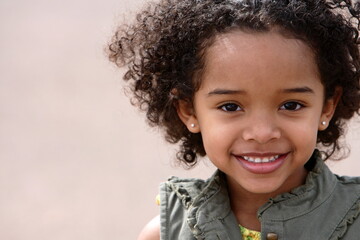 Cute little girl doing fashion photo shoot in a mountains