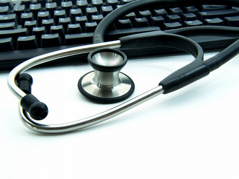 Picture of Stethoscope next to computer keyboard