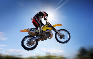 Obraz na płótnie Canvas motocross rider in the air