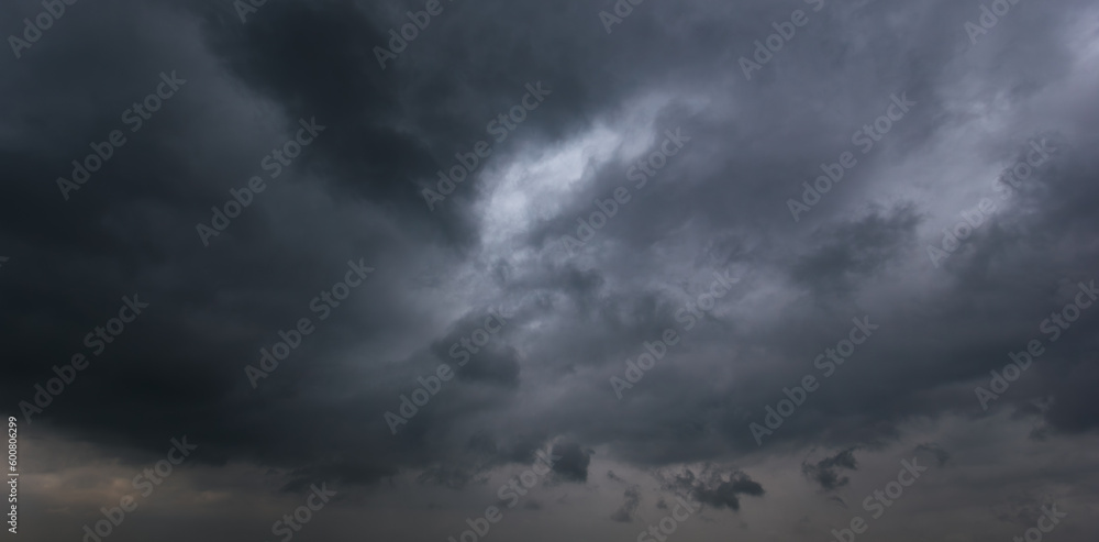 Poster the dark sky with heavy clouds converging and a violent storm before the rain.bad or moody weather s