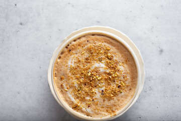 A top down view of a pistachio cappuccino.