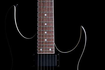 electric guitar silhouette closeup isolated on black - obrazy, fototapety, plakaty
