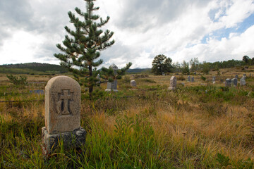 Old gravestones in a cowboy burial site in the mountains