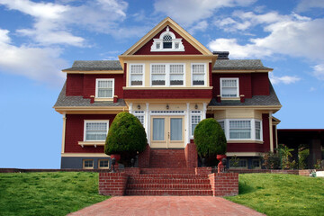 Beautiful red house with a lawn in front