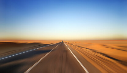 Fototapeta na wymiar Fast Driving on Desert Highway