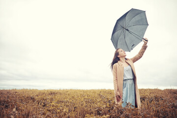 Young girl in autumn park
