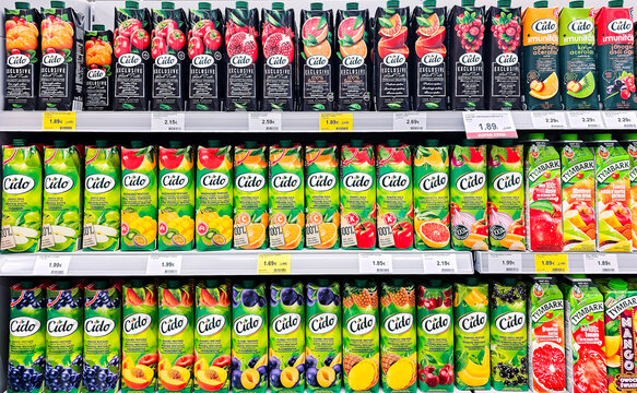LATVIA, RIGA, MAY, 2023: Cido juices tetra pack packages show on a shelf for sale in a supermarket. Riga, Latvia