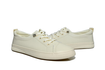 White unisex sneakers with white laces. Modern comfortable shoes.