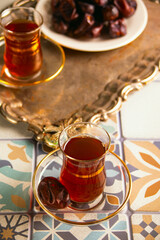Traditional Arabic Ramadan tea, islamic concept Ramadan Kareem and Eid Mubarak with dates.