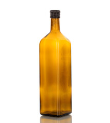 One glass bottle, macro, isolated on white background.