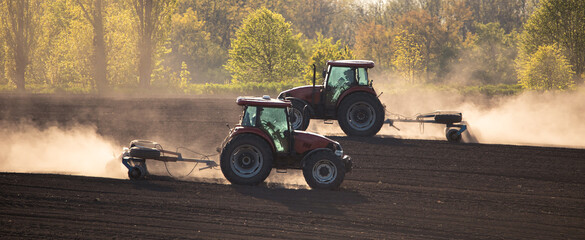 Double Trouble: Two Tractors Cultivating the Fields