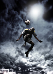 afrcican soccer player heading a ball in a stormy weather