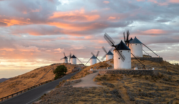 Fototapeta Windmills of Consuegra at Sunrise , Castilla-La Mancha, Spain. Beautiful exposure of the Windmills of Consuegra at Sunrise located on Castilla-La Mancha, Spain.