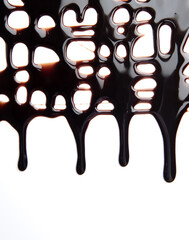 Melted chocolate dripping on white background,Dark chocolate.
