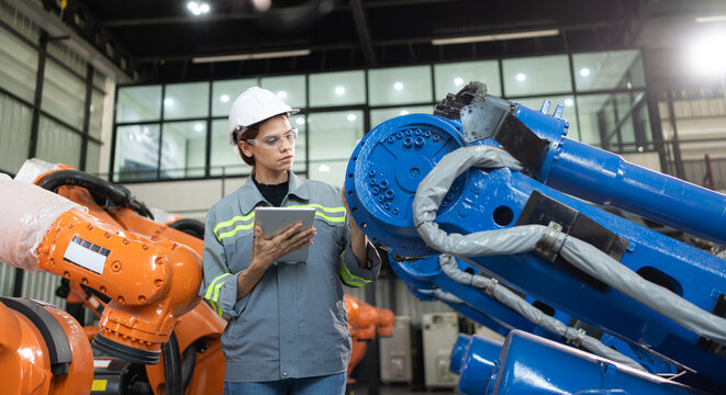 A female auditor Inspected to account for the company's robot assets that were brought to the warehouse before delivering to customers.