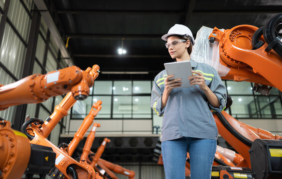 A female auditor Inspected to account for the company's robot assets that were brought to the warehouse before delivering to customers.