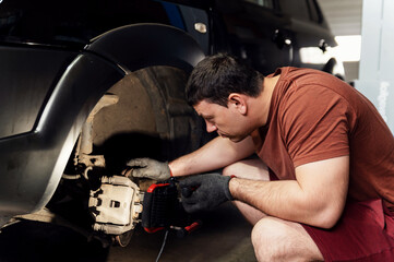 Brake disc of a car for repair, in the process of replacing new tires. Repair of car brakes in the...