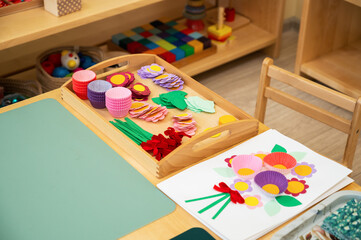 Fototapeta premium Classroom of Montessori kindergarten. The colorful Montessori material. Concept of children learning toy