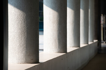 Cylindrical concrete pillars with high contrast light 45 degree shade