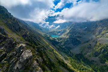 Naklejka premium Amazing nature landscape turquoise Kuyguk waterfall and Kuiguk lake in Altai mountains, Siberia Russia. Aerial top view