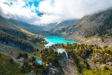 Fototapeta na wymiar Amazing nature landscape turquoise Kuyguk waterfall and Kuiguk lake in Altai mountains, Siberia Russia. Aerial top view