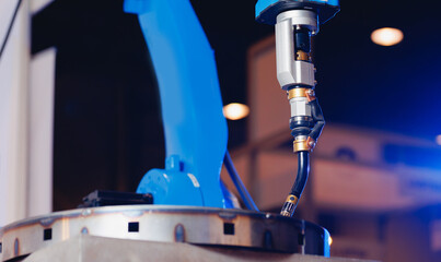 CNC Automatic robot arm manipulator for welding parts in industrial production