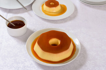 A plate of flan with caramel sauce on it