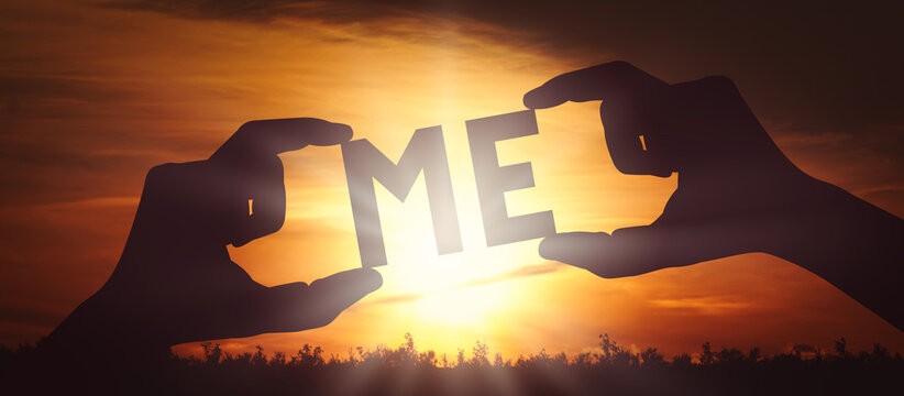 Me - human hands holding black silhouette word