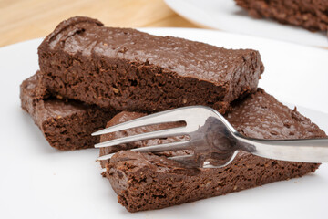 Delicate, soft chocolate banana dessert, cupcake on a white platter. 
