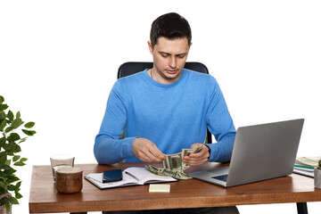 handsome businessman working on laptop and holding money