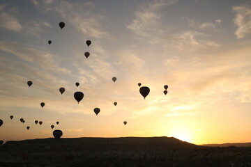 hot air balloon flying in the sunset