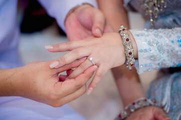 man groom in white suite hold hangs finger of woman bride.concept for wedding card background, poster,Invitation card