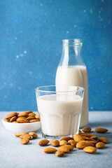 Almond milk in the glass. Vegan product. Non dairy milk.