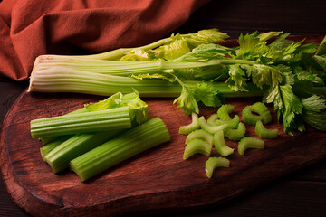 fresh bunch of celery, top view, no people, on a dark background,