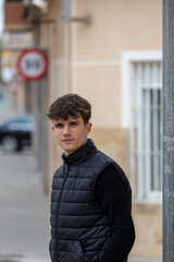 young man posing in the street