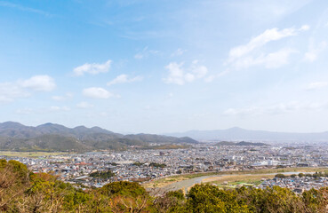 Fototapeta na wymiar Aerial view of Kyoto, Japan from the trail to Arashiyama Monkey Park Iwatayama