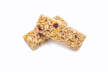 Two muesli bars on a white isolated background. Healthy sweet dessert snack. Cereal muesli with nuts, oatmeal and berries on a white background. Delicious and healthy dessert