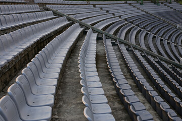 Fototapeta premium Rows of chairs for spectators in the stadium