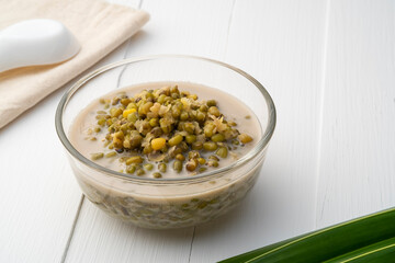 boiled green beans in coconut milk and sugar in glass bowl,Thai Dessert on wooden table
