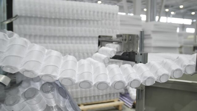 Process producing blocks of dependent springs at mattress factory indoors. classic bonnel blocks are used mattresses in modern manufactory for production of sleep products.Closeup texture of spring 