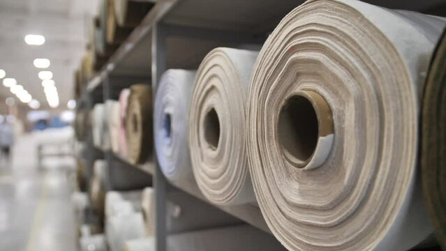 Textile factory. spinning of the fabric roll.  A large warehouse of textile products and goods. Sewing or furniture production.